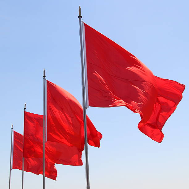 Four red flags stock photo
