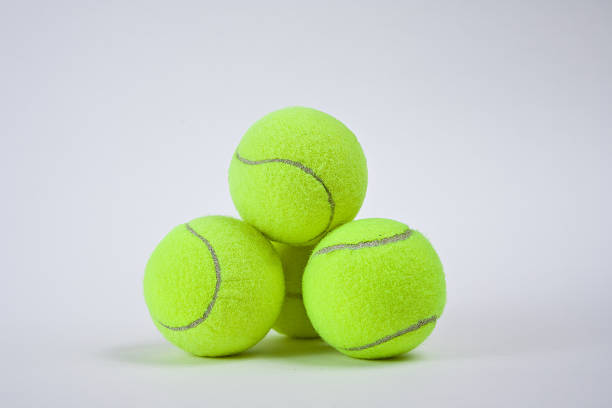 four-used-tennis-balls-stacked-on-white-picture-id147057780?k=20&m=147057780&s=612x612&w=0&h=rdhJ_EYzMwxgCLOFtGVRQGbG8HojVRV0qlabkz4v-Lc=