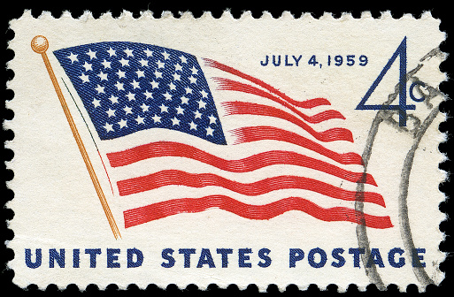 Four Cent Fourth of July 1959 Stamp - on this date a 49th star was added to the American flag to represent the new state of Alaska. The stamp is discoloured due to age