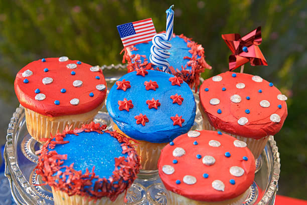 Fourth of July Cupcakes, American Flag on Patriotic Picnic Cake "Outdoor picnic in celebration of Fourth of July, Labor & Memorial day: Cupcakes American summer holiday dessert. (SEE LIGHTBOXES BELOW for many more sweet cake & food Backgrounds...)" memorial day background stock pictures, royalty-free photos & images