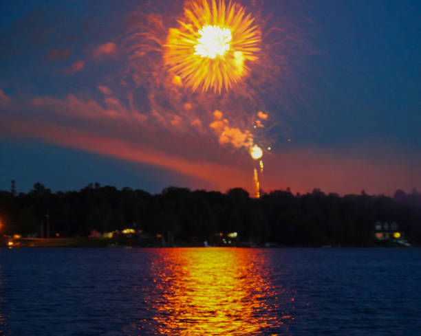 Fourth of July Fireworks over water in Lake Huron, 2020 stock photo