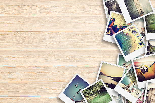 Frame with old paper and photos on wooden background. Frame with old paper and photos. Objects over wooden planks. summer photos stock pictures, royalty-free photos & images