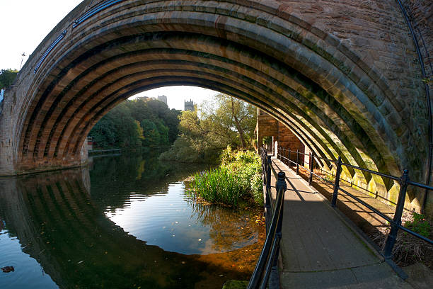 Framwellgate Bridge, Durham City, Durham, UK An ultra wide angle view of the medieval Framwellgate Bridge in the City of Durham, County Durham and looking upstream of the River Wear towards Durham Cathedral. Image taken early in the morning before any photo-bombers. sRGB embedded colour profile. Durham Cathedral stock pictures, royalty-free photos & images