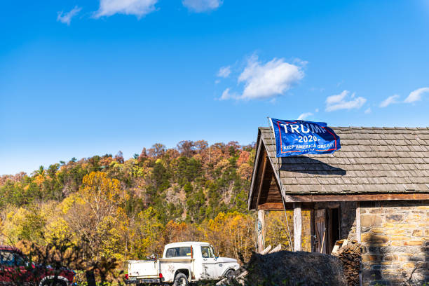 Frederick County, Virginia with election flag banner sign for Trump KAG keep america great in 2020 Middletown, USA - October 27, 2019: Frederick County, Virginia countryside with election flag banner sign for Trump KAG keep america great in 2020 by house and truck in rural mountains donald trump stock pictures, royalty-free photos & images
