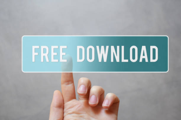 Free download - hand pressing transparent blue button Free download - hand pressing transparent blue button  on virtual touchscreen interface  grey background with copy space for text. Internet application files downloading sharing  concept. free images for downloads stock pictures, royalty-free photos & images