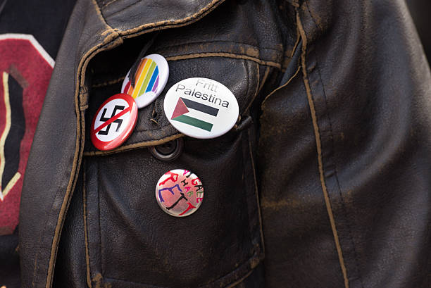 Free Palestine, LGBTQ and anti-swastika pins stock photo