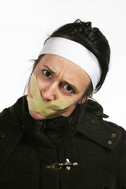 Freedom of speech Censor and freedom of speech concept. Mouth tied. Human rights human mouth gag adhesive tape women stock pictures, royalty-free photos & images