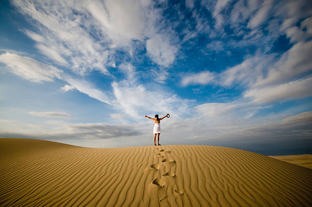 Freedom Woman alone in a desert in peru. hot peruvian women stock pictures, royalty-free photos & images