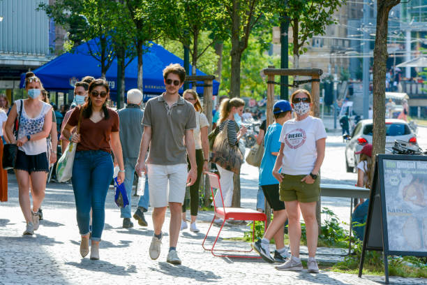 Freiburg im Breisgau, Bertoldstrasse, people with protective masks stock photo