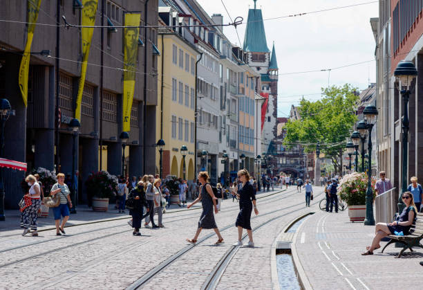 Freiburg im Breisgau, Kaiser-Joseph-Strasse with trams and passers-by stock photo