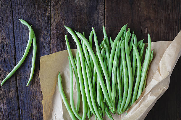 French Beans French Beans on the old wood green bean stock pictures, royalty-free photos & images