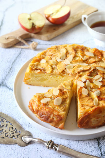 French cuisine. Invisible apple tart, almond petals dressing stock photo