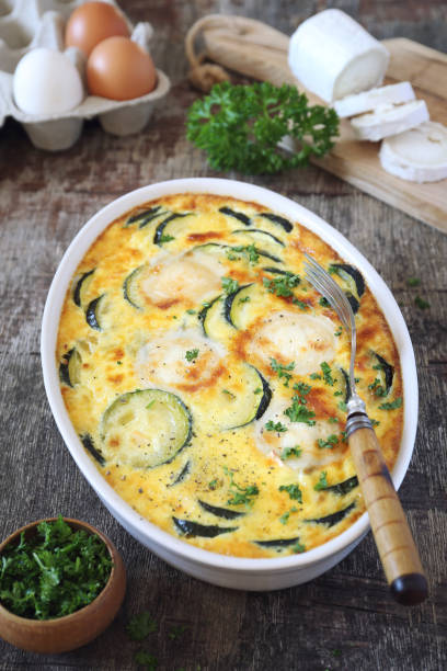 French cuisine. Vegetable zucchini clafoutis with goat cheese stock photo