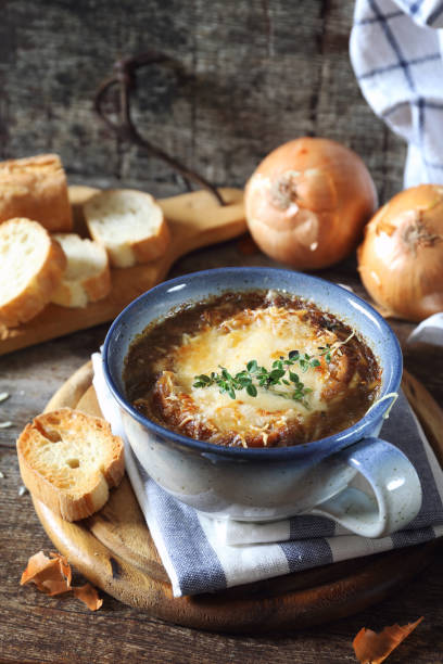 French onions soup with baguette, rustic style stock photo