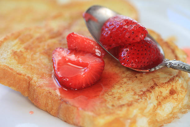 French toast with macerated strawberries stock photo