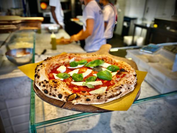 fresh artisan caprese pizza on display at the mercato centrale firenze. stock photo