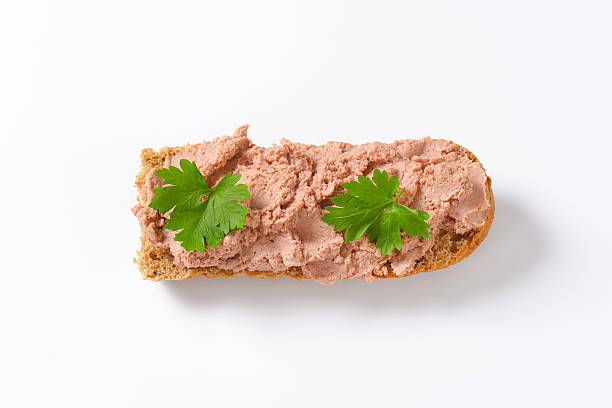 Fresh baguette with pate Baguette roll with pate on white background liver pâté photos stock pictures, royalty-free photos & images