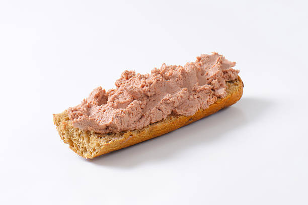 Fresh baguette with pate Baguette roll with pate on white background liver pâté photos stock pictures, royalty-free photos & images
