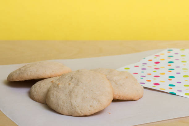 Fresh baked vanilla sugar cookies with yellow background stock photo