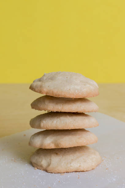 Fresh baked vanilla sugar cookies with yellow background stock photo
