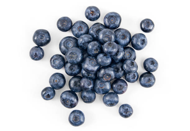 Fresh Blueberry Pile of fresh blueberries over white background. blueberry stock pictures, royalty-free photos & images