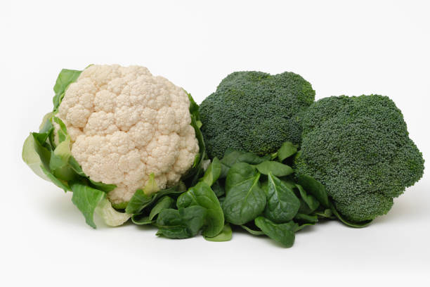Fresh Broccoli, Spinach and Cauliflower isolated on white. stock photo