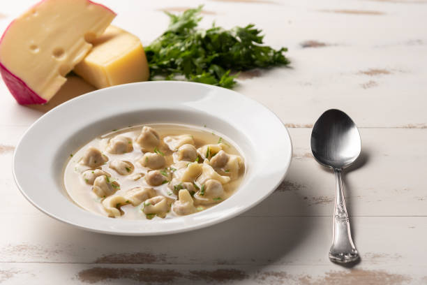 Fresh Capeletti Soup; Capeletti in Brodo-Italian cuisine, soft light, copy space stock photo