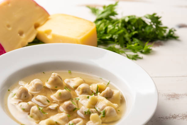 Fresh Capeletti Soup; Capeletti in Brodo-Italian cuisine, soft light, copy space stock photo