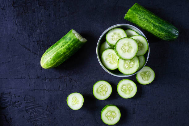 Fresh Cucumber for Health on black ground Fresh Cucumber for Health on black ground cucumber stock pictures, royalty-free photos & images