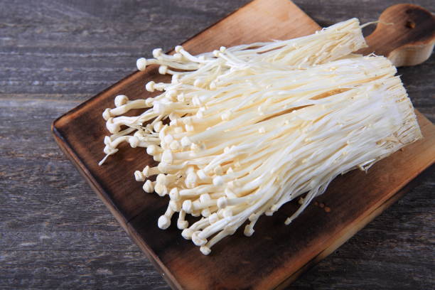 Fresh Enoki Mushroom Fresh Enoki Mushroom enoki mushroom stock pictures, royalty-free photos & images