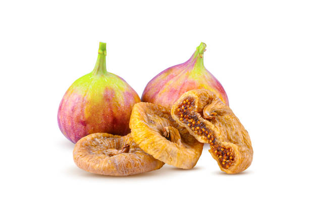 Fresh figs and dried figs isolated on white background. stock photo