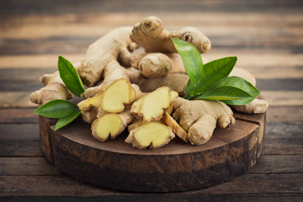 Fresh ginger root on the wooden table  ginger spice stock pictures, royalty-free photos & images