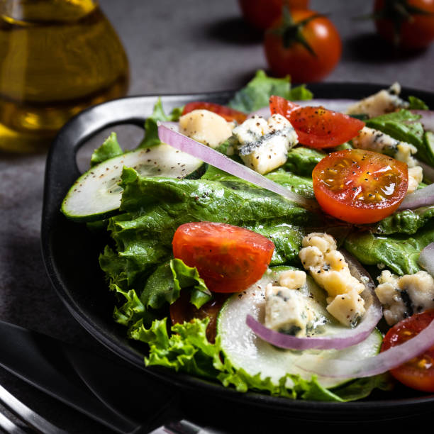 Fresh green salad with blue cheese stock photo