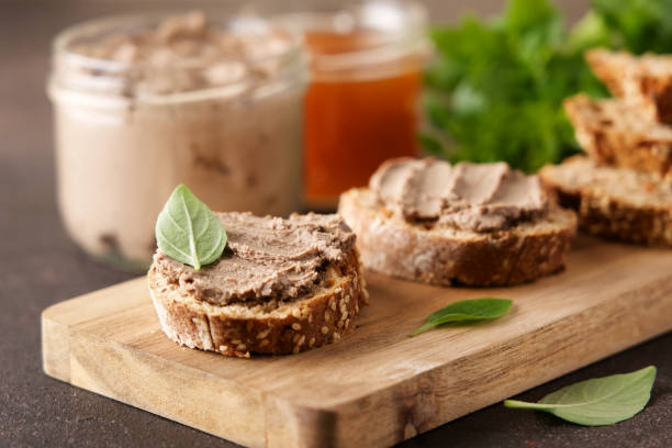 Fresh homemade liver pate on bread Traditional French meat appetizer crostini photos stock pictures, royalty-free photos & images