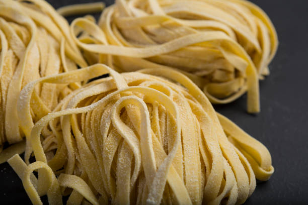 Fresh homemade pasta made with semolina flour and copy area stock photo