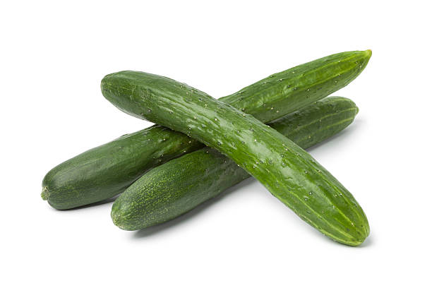 Fresh japanese cucumbers Fresh japanese cucumbers and slices on white background cucumber stock pictures, royalty-free photos & images