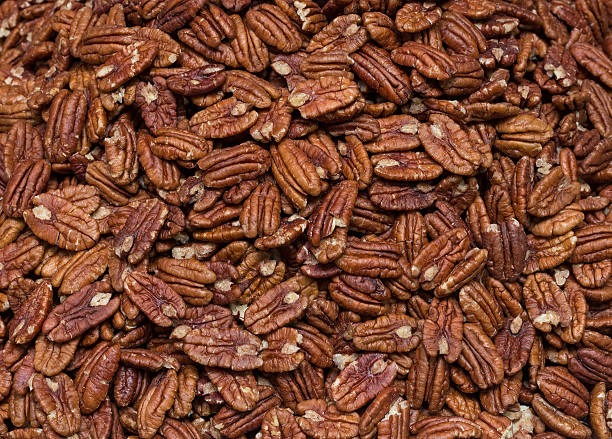 Fresh pecans bulk. pattern Fresh pecans bulk. pattern pecan stock pictures, royalty-free photos & images