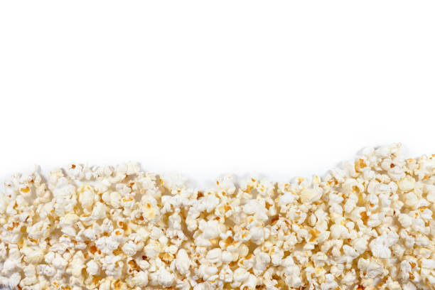 Fresh popcorn on a white plate with clipping path. Top view. Fresh popcorn on a white plate with clipping path. Top view. popcorn stock pictures, royalty-free photos & images