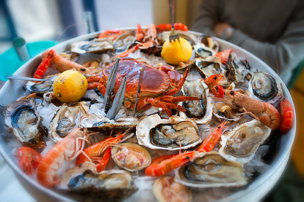 fresh, raw and cooked seafood platter, cannes, france - shellfish bildbanksfoton och bilder
