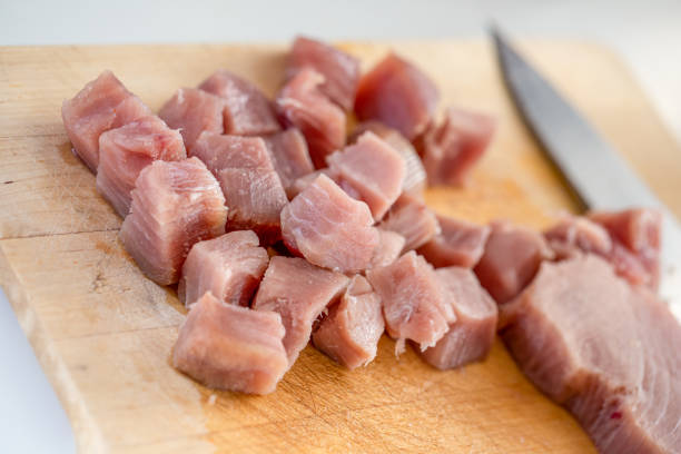 Fresh raw tuna steaks, cut into chunks stock photo