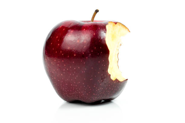 Fresh red apple nibble on a white background stock photo