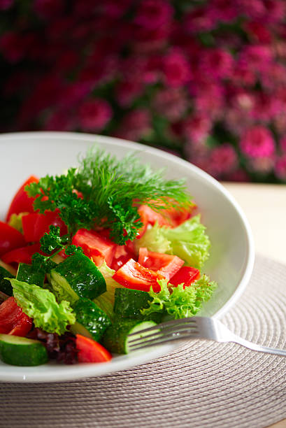 Fresh salad with cucumber, tomato and pepper stock photo