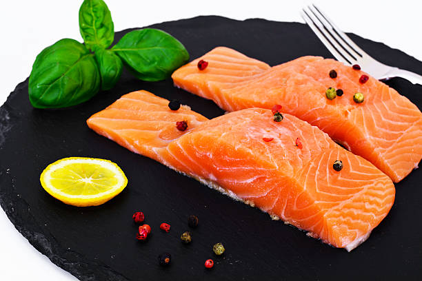 Fresh Salmon on White Plate. Studio Photo
