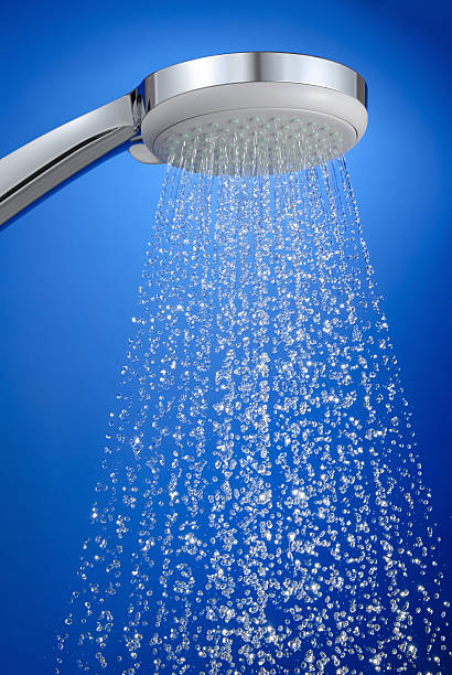 Fresh shower, crisp drops on blue background stock photo