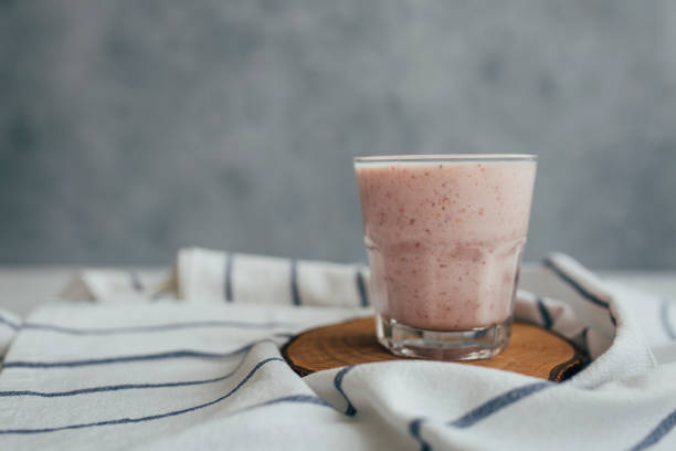 Fresh Strawberry and Banana Smoothie in Glass Vegetarian vegan diet concept. strawberry smoothie stock pictures, royalty-free photos & images