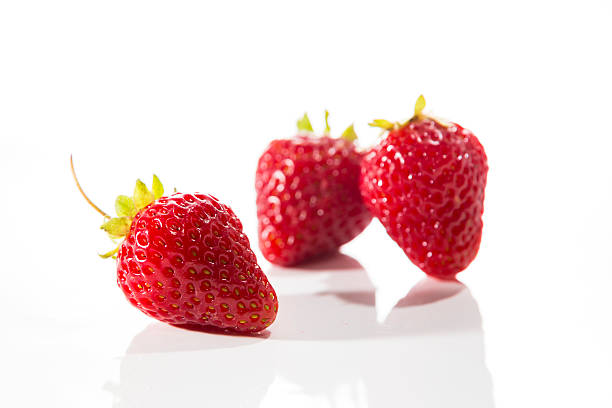 Fresh Strawberry Closeup on White Background stock photo