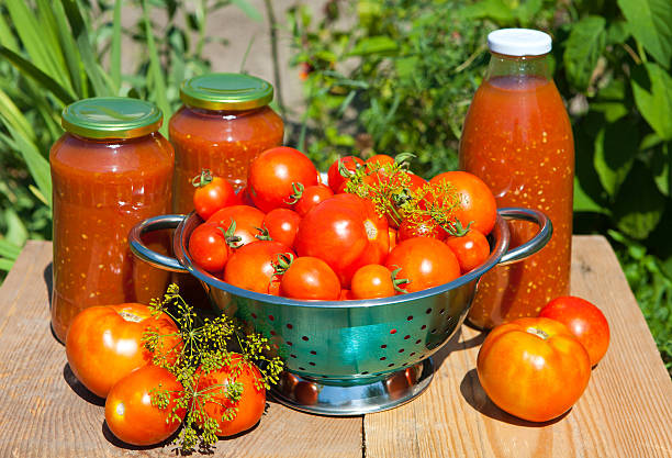 Fresh tomatoes and homemade tomato sauce stock photo