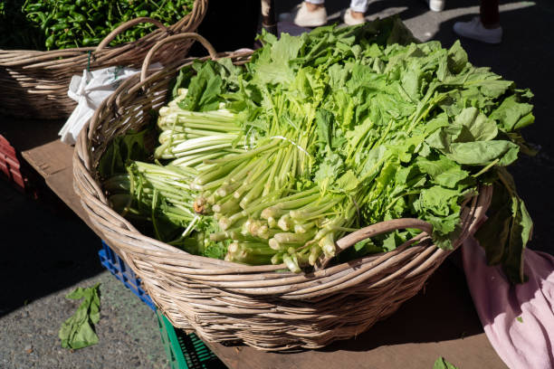 Fresh turnip greens Fresh turnip greens on a basket at local farmers market. Grelos of Galicia, Spain broccoli rabe stock pictures, royalty-free photos & images