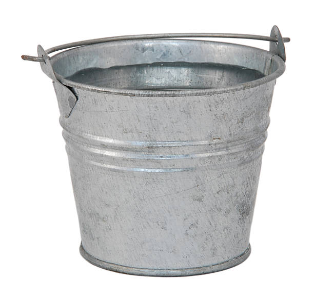 Fresh water in a miniature metal bucket Fresh water in a miniature metal bucket, isolated on a white background bucket stock pictures, royalty-free photos & images