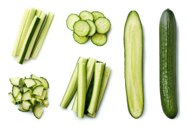 Fresh whole and sliced cucumber Fresh whole and sliced cucumber isolated on white background. Top view chopped food stock pictures, royalty-free photos & images